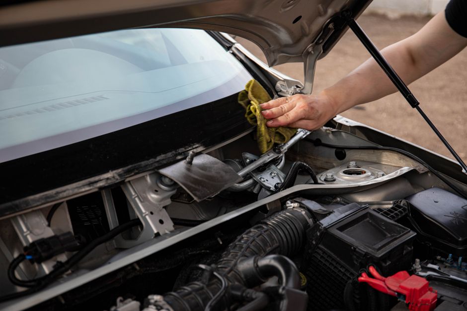 Mechanic repairing car windshield